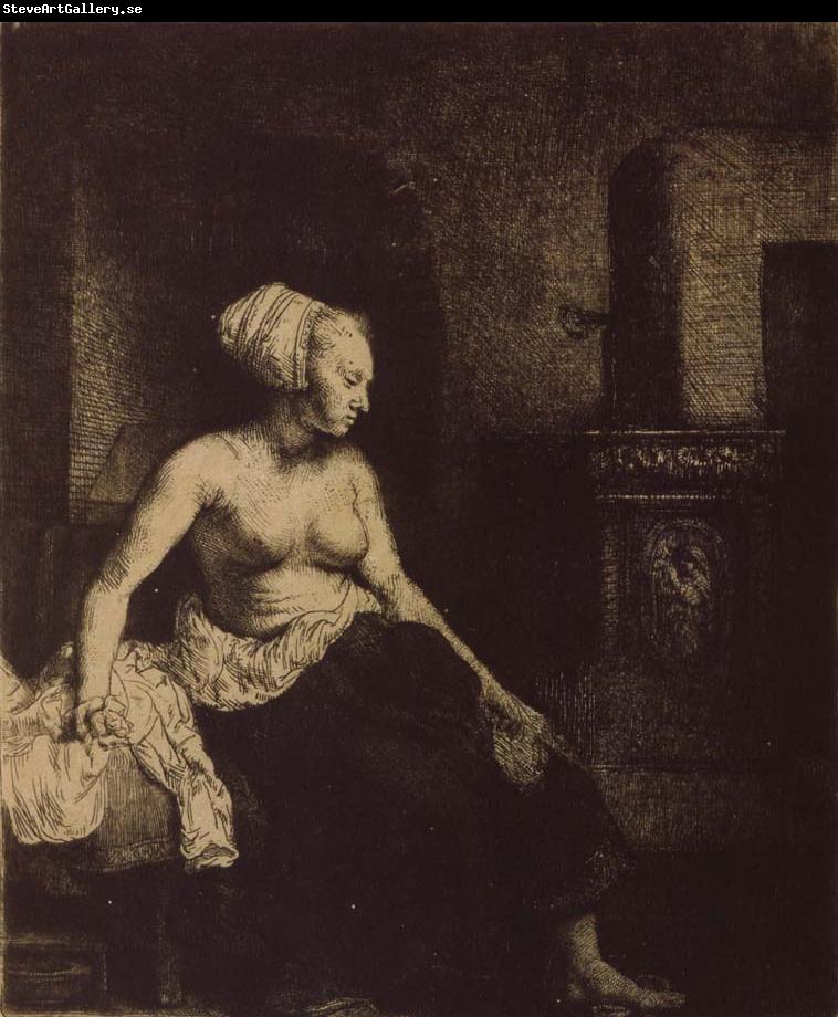 REMBRANDT Harmenszoon van Rijn Woman sitting Half-Dressed beside a Stove